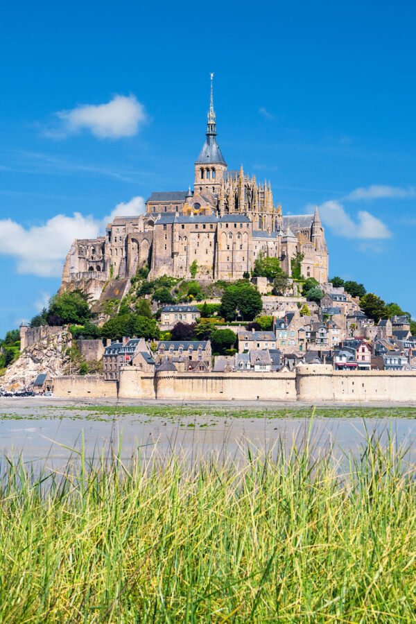 view-of-famous-mont-saint-michel-and-green-grass-france-europe